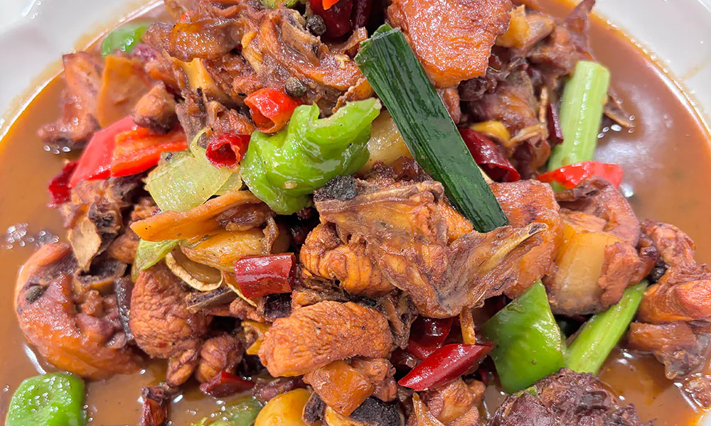 Fragrant spicy braised chicken with veggies at HuaYuChuan, a Chinese Restaurant in Flushing