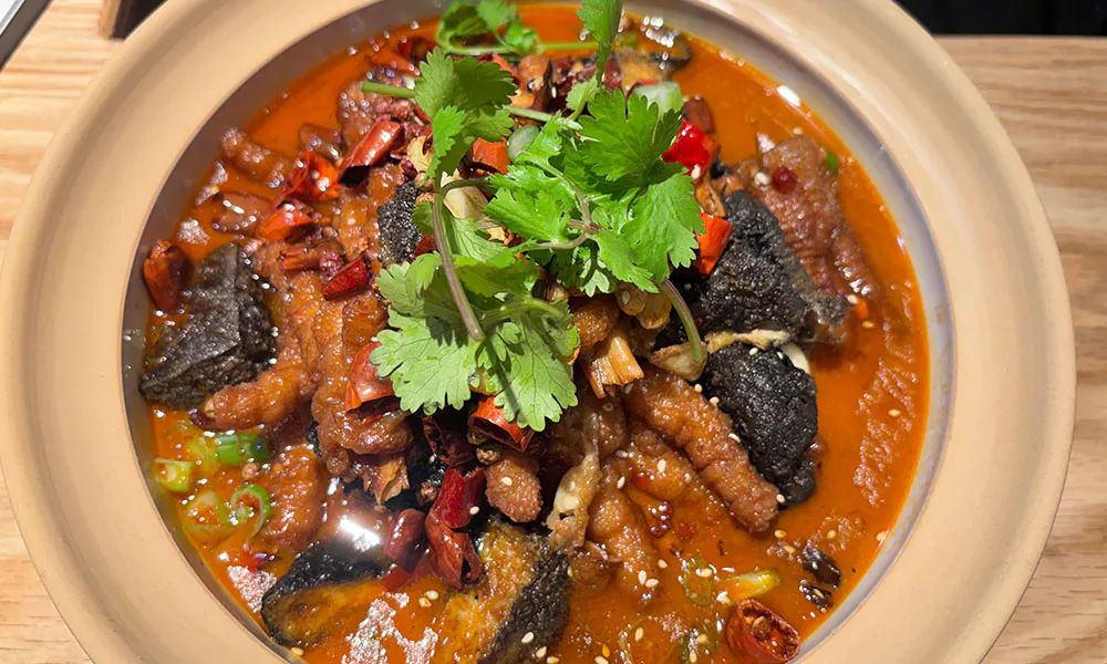 Spicy braised chicken feet & eel in clay pot at HuaYuChuan, a Chinese Restaurant in Flushing
